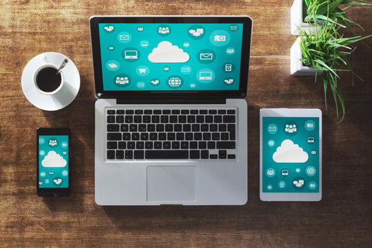 Cloud computing and social network interface on a laptop, tablet and smartphone screen
