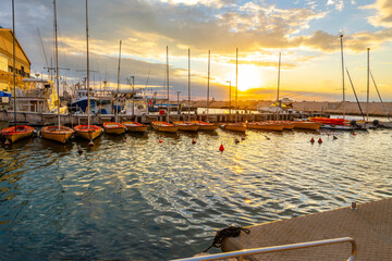 Small boats in the marina at sunset at the ancient port city of Old Jaffa, Israel, one of the...