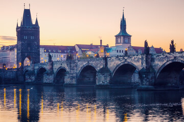 Fototapeta na wymiar Prague city sunrise over Charles Bridge on Vltava river, Czech Republic