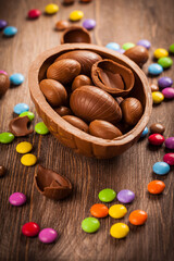 Fototapeta na wymiar Assorted chocolate for Easter on wooden background