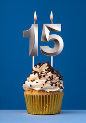 Horizontal birthday card with cake - Lit candle number 15 on blue background