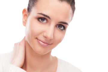 Attractive smiling woman touching her neck and posing on white background