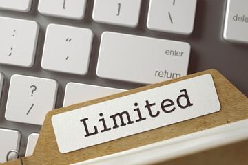 Limited Concept. Word on Folder Register of Card Index. Card Index Lays on Computer Keyboard....