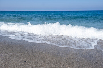 Sea waves run on the shore of the sea or ocean. Beautiful relaxing view on vacation.