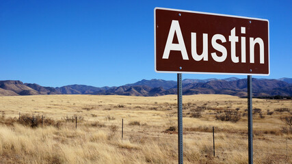 Austin road sign with blue sky and wilderness © Designpics