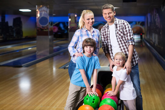 Smiling family in bowling