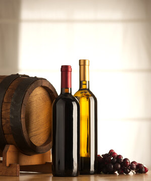 Selection of red and white wine with window on background.