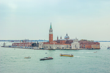 Fototapeta na wymiar High view of San Giorgio Maggiore in Venice. Panoramic aerial view at San Giorgio Maggiore island, Venice, Veneto, Italy. Early spring. Highlighting in cold colors