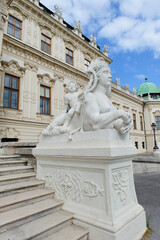 Fototapeta na wymiar Vertical view of part of Upper Belvedere in Vienna in Austria with staircase and statue of sphinx and boy