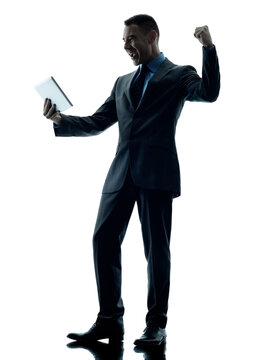 One Caucasian Business Man Standing Using Digital Tablet  Happy Silhouette Isolated On White Background