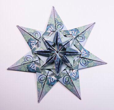 snowflake origami made of banknotes rubles. Handmade