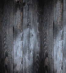 Natural Dark Wooden background. Old dirty wood tables or parquet with knots and holes and aged partculars.