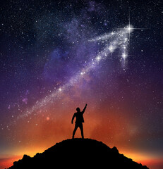 Businessman on a mountain indicate an arrow with stars