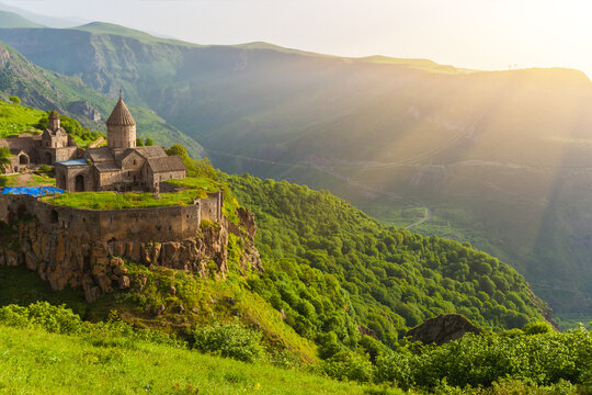 Ancient monastery in setting sun. Tatev. Armenia