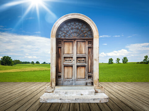 An image of a nice landscape with an old door