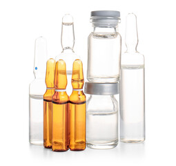 Medical ampules and bottles with medicines on white background