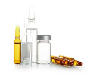 Medical ampules and bottle with medicines on white background