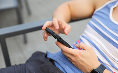 hand tightly gripping a smartphone, symbolizing the pervasive distraction of modern social media and its impact on human connection