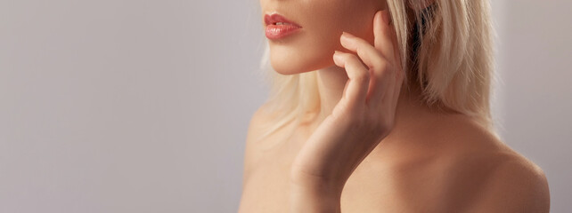 Lips makeup. Plumping gloss. Care balsam. Unrecognizable woman with curvy puffy mouth in lipstick...