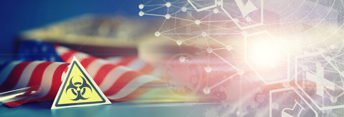 American flag, test tubes and biohazard sign. The concept of American biolabs and research centers.