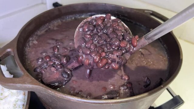 ugly, not appetizing food boiled beans in saucepan to pick up with a ladle slurry tasteless to pour back unpleasant to watch poor serving Healthy food stretches liquid on the stove cook bean soup
