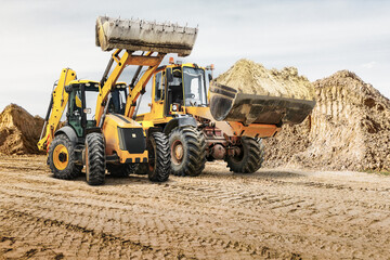 Modern construction machinery at a construction site in a quarry. Powerful modern equipment for...