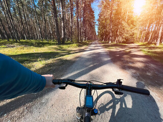 Obraz na płótnie Canvas POV bike handlebar closeup. Concept of riding a bicycle outdoors