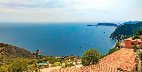 Scenic view of the Mediterranean coastline and medieval houses from the top of the town of Eze...