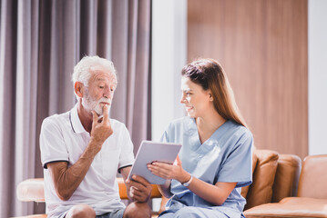 Nurse take care to senior man with alzheimer's disease in a nursing home
