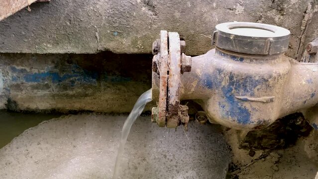 Dirty water flows from the water meter pipe. Chemical waste water from industrial process. Wastewater Treatment Procedure (WWTP)