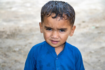 sad refugee child in astonishment