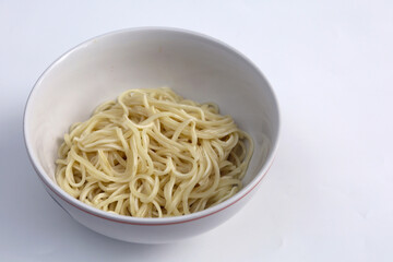 Plain instant noodles without topping in bowl isolated on white background. Asian and Chinese style fast food concept.