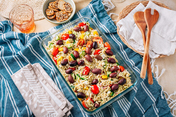 Picnic time - homemade orzo pasta salad with feta, olives, tomatoes