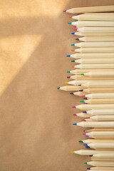 pencils on wooden background