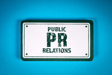 Public Relations. Sticky note with text on a blue background