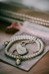 A beautiful  necklace made up of pearls and a heart in centre