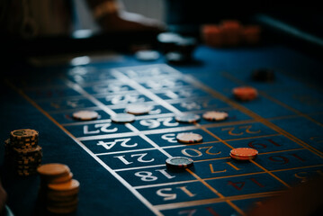 Close up of a casino chips placed in the bet on a roulette table