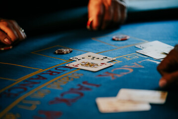 Playing poker cards on casino table
