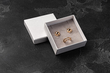 Jewelry box with earrings on a gray background