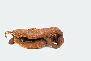 Closeup of Ripe Tamarind Isolated on White Background with Copy Space