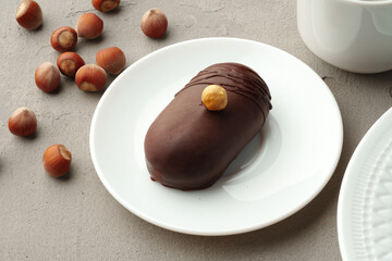 Delicious chocolate biscuit cakes with nuts on white plate