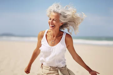 Gardinen AI generated image of happy dancing mature woman at the beach © Kalim