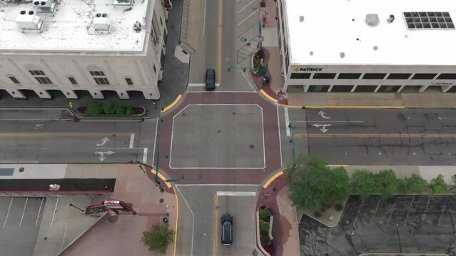 Downtown Elkhart, Indiana with drone video looking down at an intersection and tilting up.