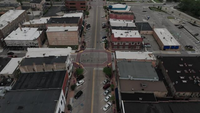 Downtown Elkhart, Indiana with drone video tilting down.