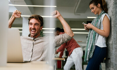 Group of happy multiethnic business people having fun and chatting at workplace office