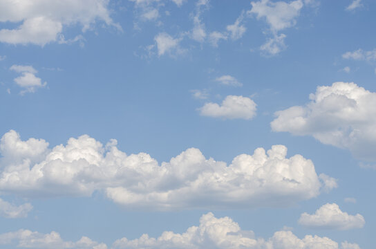 Cumulus clouds on the blue sky. Summer sky.