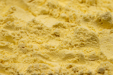 Fototapeta na wymiar Pile of corn flour as background, spice or seasoning as background. close-up cornmeal