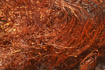 Close up of a bare copper wire background.