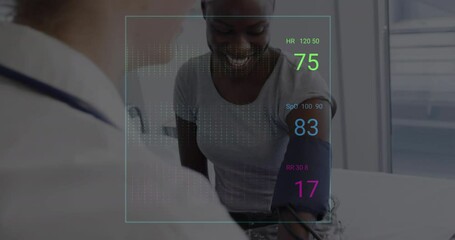 Animation of colourful cardiographs over happy diverse patient and doctor taking pressure - Powered by Adobe