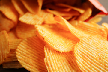 Potato chips in open bag, delicious BBQ seasoning spicy for crips, thin slice deep fried snack fast food.